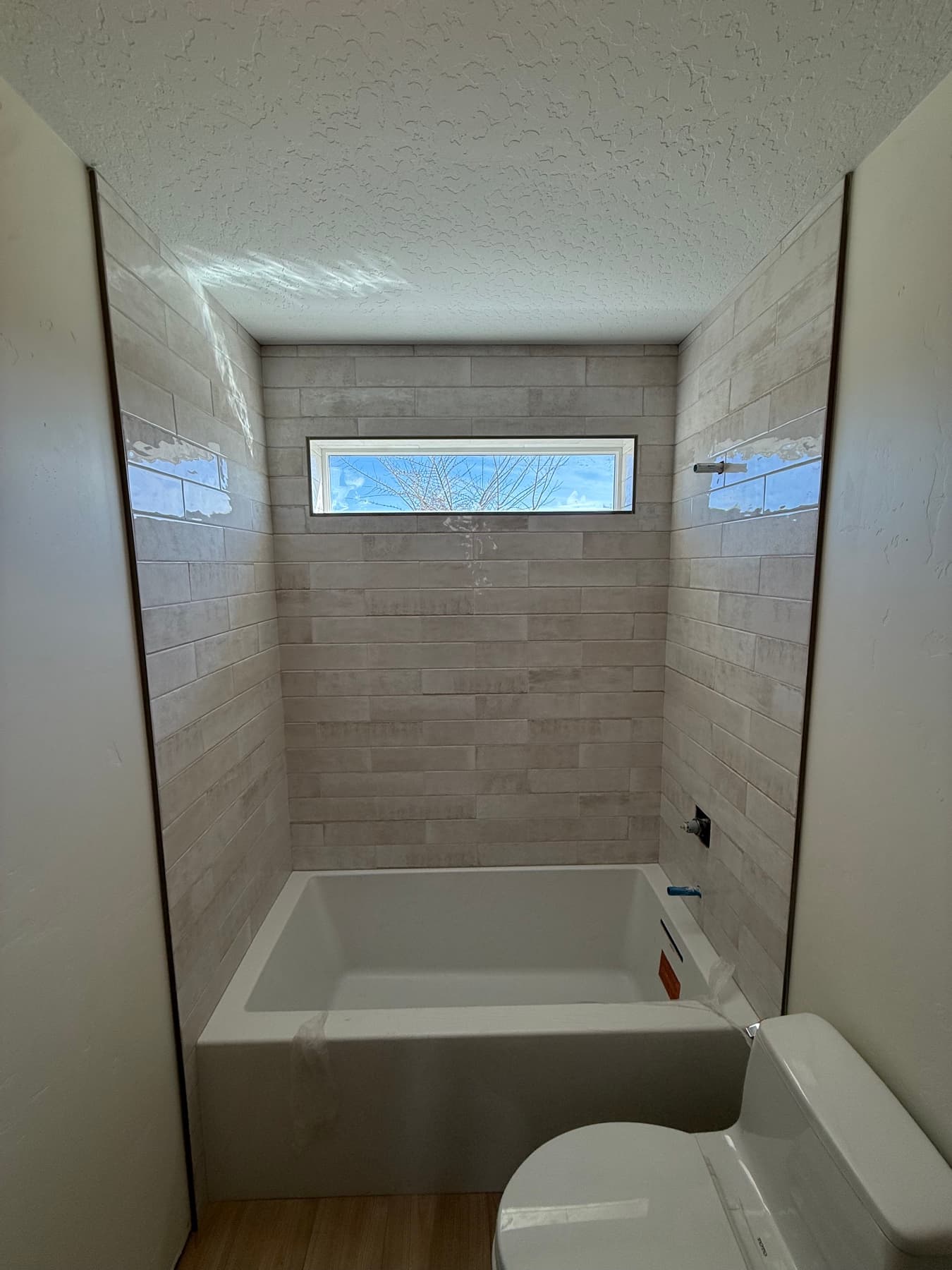 Glass-enclosed marble shower